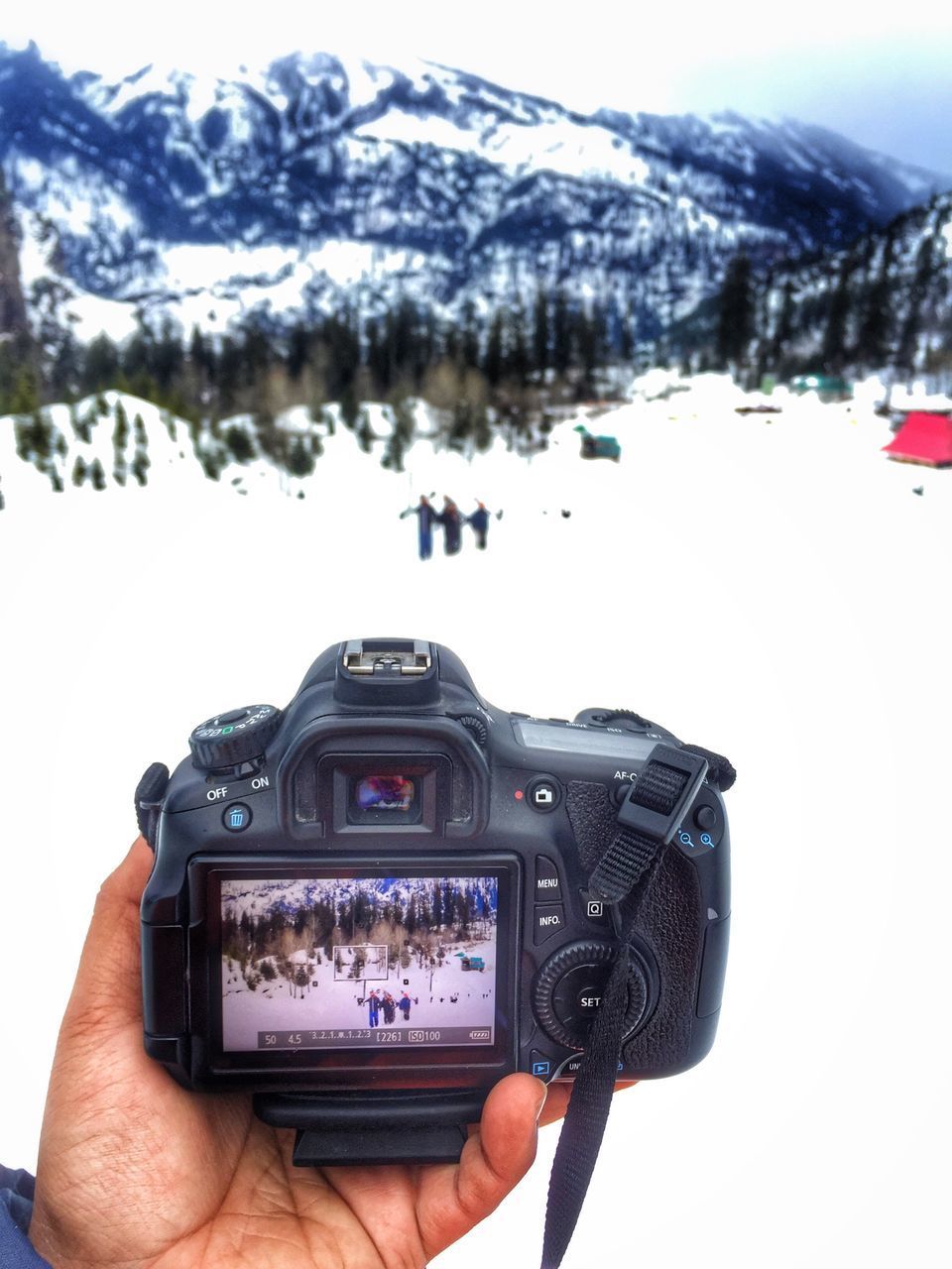 PERSON PHOTOGRAPHING IN SNOW