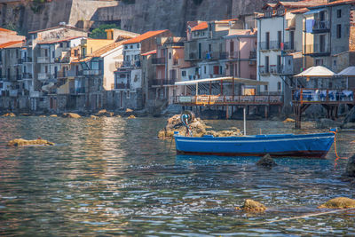 Boats moored in sea