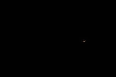 Low angle view of moon in sky at night