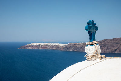 Cross against sea and sky