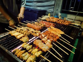 High angle view of meat on barbecue grill