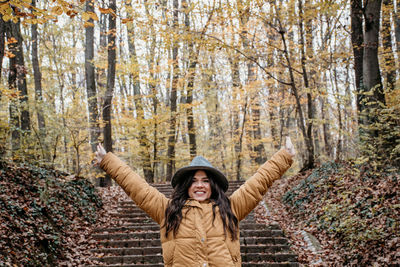 Portrait of a beautiful young woman, autumn, forest, outdoors.