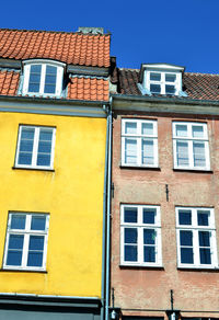 Low angle view of building against blue sky