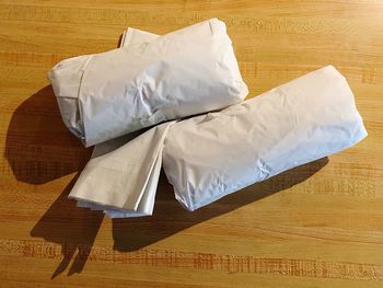 High angle view of white paper on table