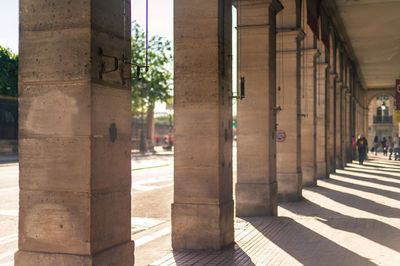 Sunlight falling on street amidst buildings