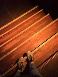 Low section of woman on wooden steps