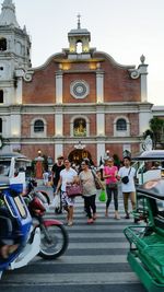 Tourists in front of building