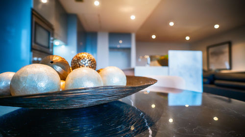 Close-up of illuminated lighting equipment on table at home