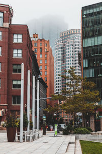 Buildings in city against sky