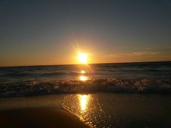 Scenic view of sea at sunset