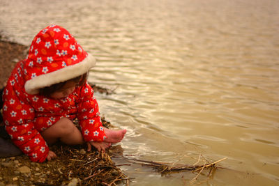 High angle view of girl sitting on beach