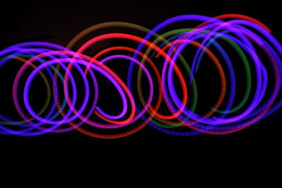 Multi colored light painting against black background