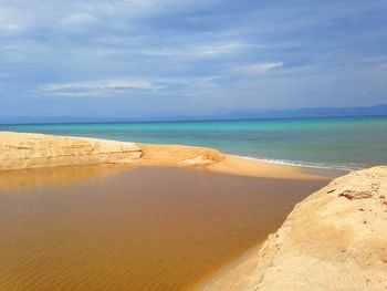 Scenic view of beach against sky