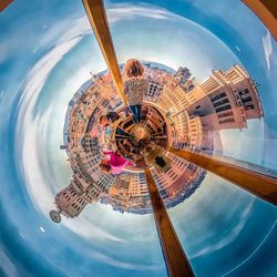 Low angle view of ferris wheel against sky