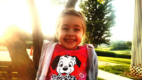 Portrait of smiling young woman in park