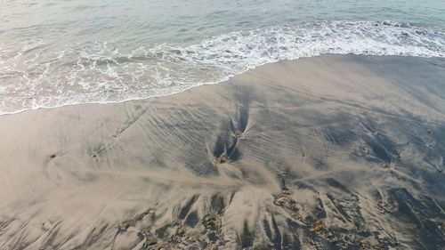 High angle view of sand at beach