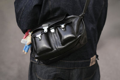 Midsection of man wearing hat