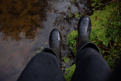 Rubber boots over river