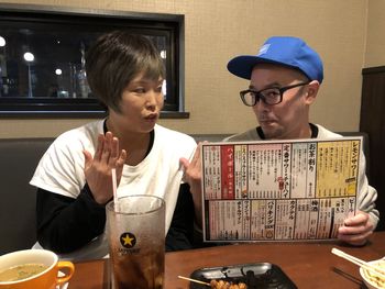 Man and woman sitting at restaurant table