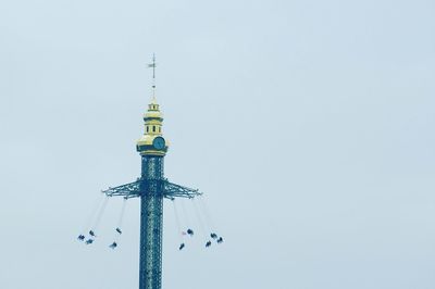 Low angle view of communications tower against clear sky
