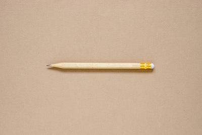 High angle view of pencils on paper