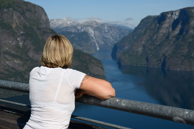 Rear view of woman looking at mountains