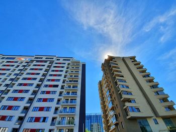 Low angle view of buildings against blue sky