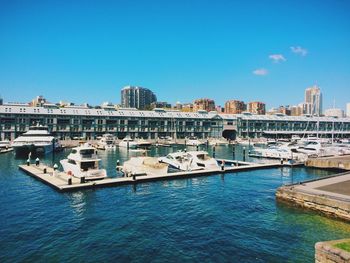Boats in canal along buildings