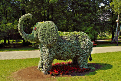 Statue against trees in park