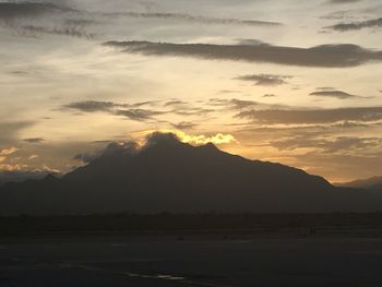 Scenic view of mountains against sky during sunset