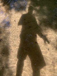 Shadow of man on beach