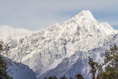 Scenic view of snowcapped nandakot  mountains against sky