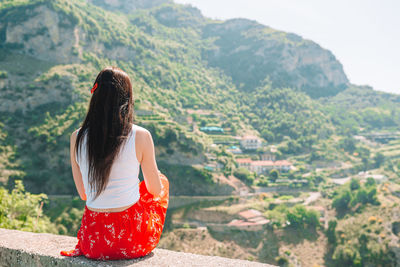 Rear view of woman looking at mountains