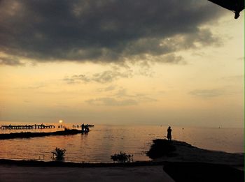 Scenic view of sea against cloudy sky