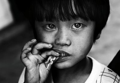 Close-up portrait of child eating food