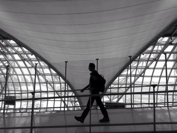 Full length of woman standing in modern building