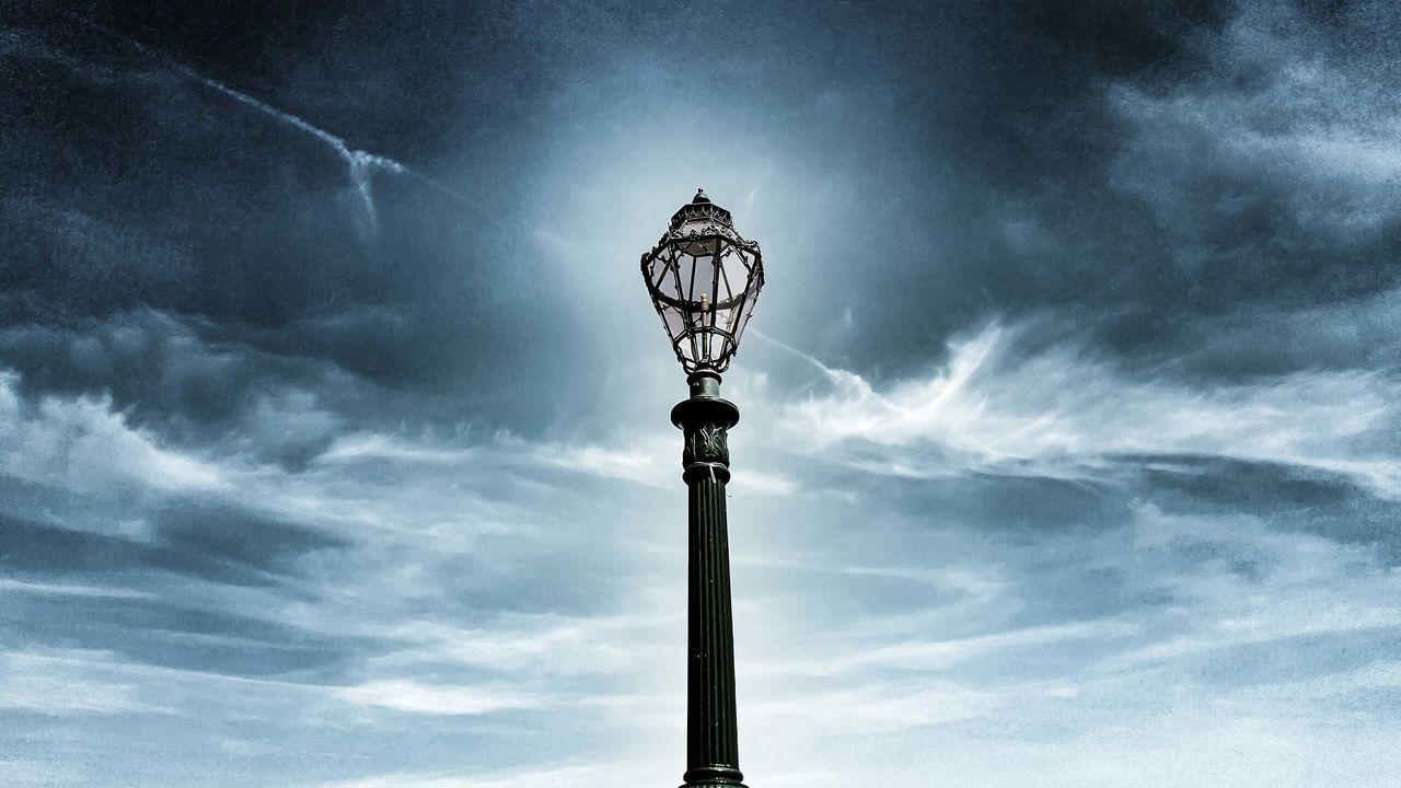 LOW ANGLE VIEW OF STREET LIGHTS AGAINST SKY