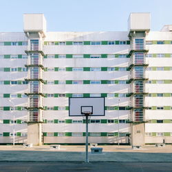 Basketball hoop against building