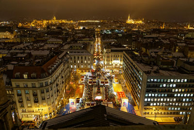 High angle view of city buildings at night