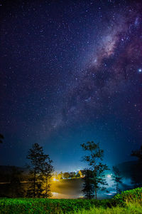 Scenic view of field against sky at night