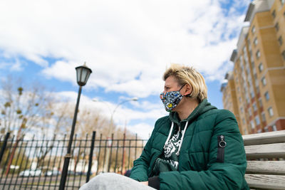 Young girl with short hair in protective mask.