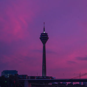 Low angle view of tower at sunset