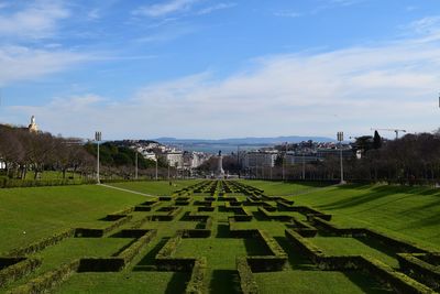 Panoramic view of green landscape against sky