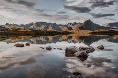 Scenic view of lake and rocks against sky