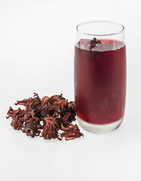 Close-up of drink in glass over white background