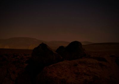 Scenic view of landscape against sky at night