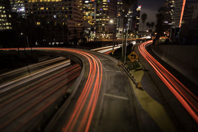 High angle view of light trails on road at night