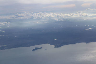 Aerial view of snowcapped mountains against sky