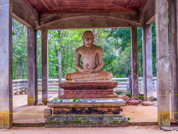 Statue against temple