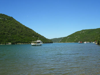 Scenic view of sea against clear blue sky